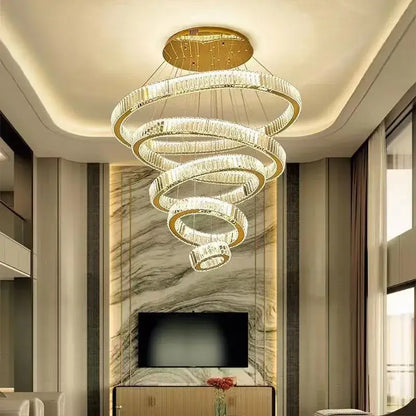 Modern spiral crystal chandelier with polished gold rings and clear crystals by decorbites for villa lighting