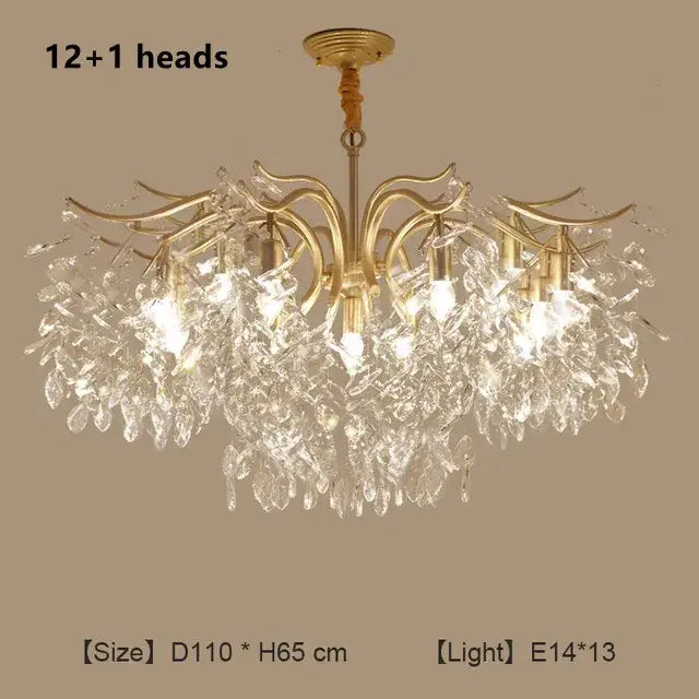 Gold-toned decorbites crystal chandelier with 12 plus 1 crystal leaf arms and clear glass droplets for modern luxury lighting