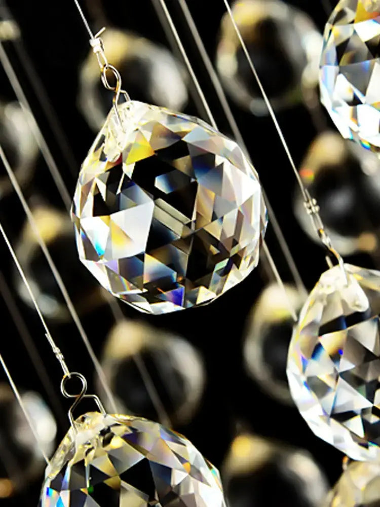 Clear faceted crystal pendant with teardrop shape and reflective surfaces in decorbites crystal chandelier for modern luxury