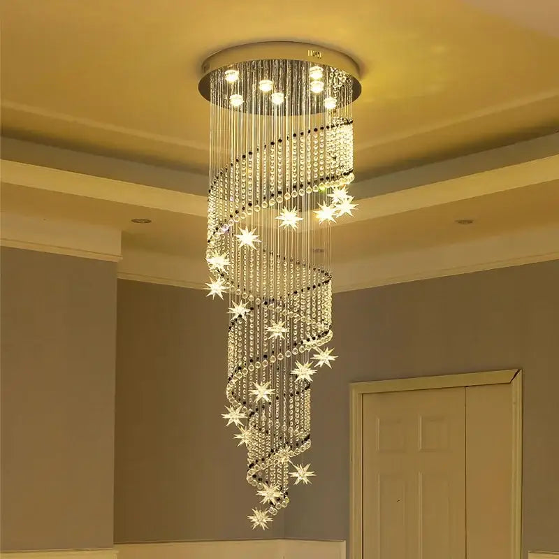 A decorbites crystal chandelier with cascading crystal strands and star accents on a sleek metallic base for modern luxury