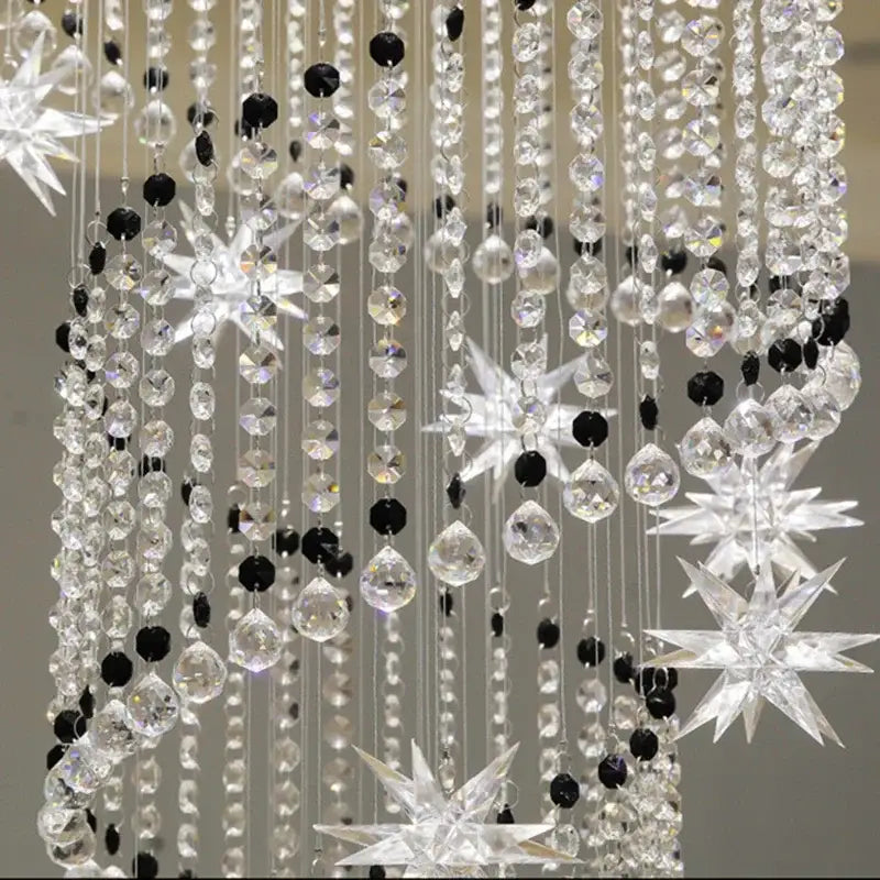 Decorbites crystal chandelier featuring sparkling black and clear crystals with star-shaped ornaments for modern luxury lighting