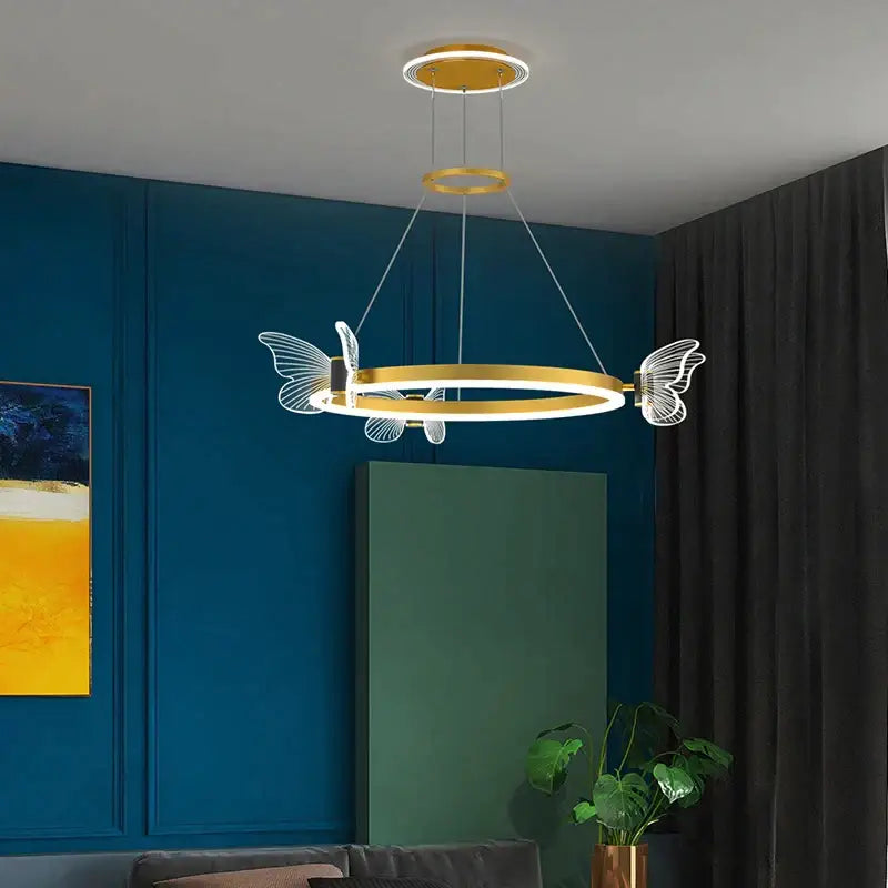 Gold-toned circular decorbites crystal chandelier pendant light with translucent butterfly wing accents for modern luxury lighting