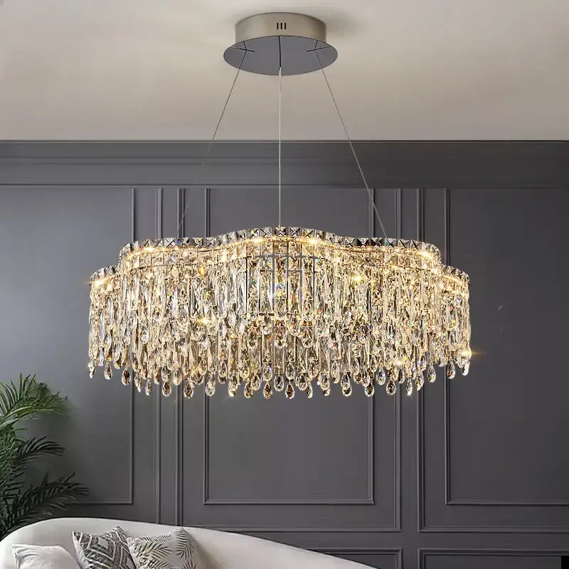 Decorbites crystal chandelier with circular frame and cascading teardrop crystals for modern luxury lighting