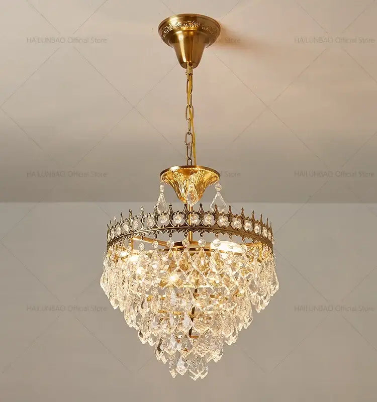 Decorbites crystal chandelier gold toned with cascading clear crystal droplets and decorative circular frame for modern luxury lighting