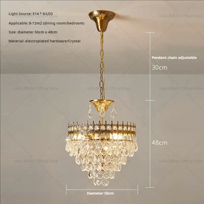 Gold-toned decorbites crystal chandelier with crystal droplets and decorative crown frame for modern luxury lighting