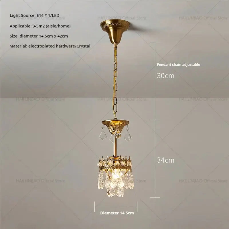 Gold-toned decorbites crystal chandelier with ornate design and clear dangling crystals for luxury lighting