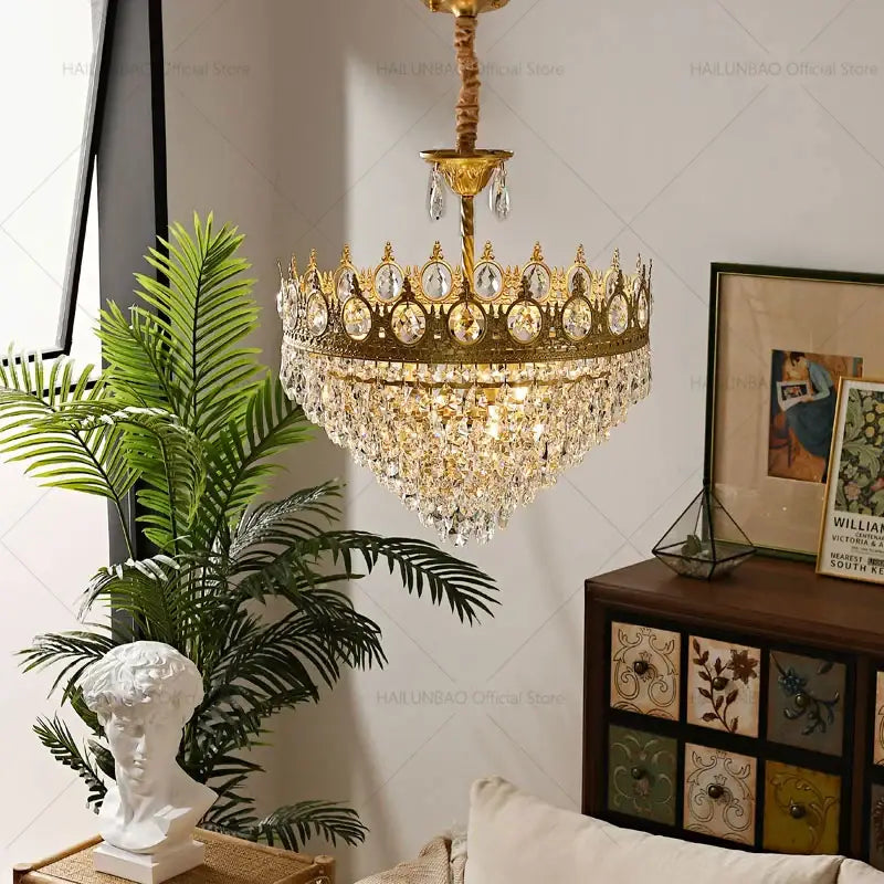 Golden crown-shaped decorbites crystal chandelier adorned with clear crystal droplets for modern luxury lighting