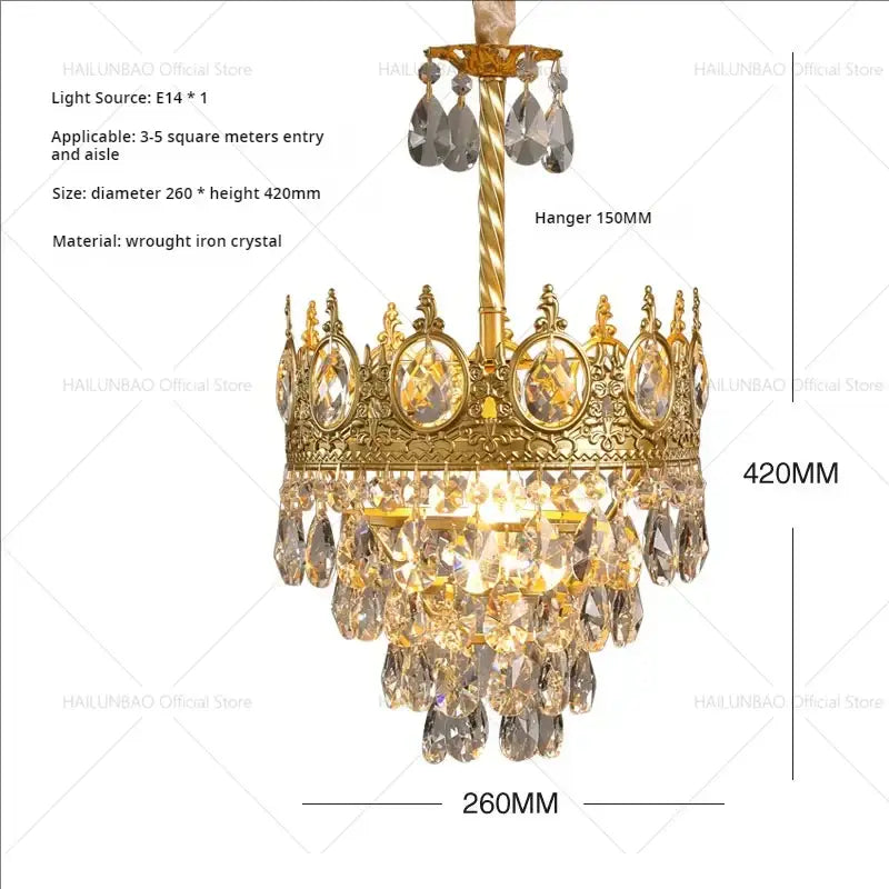 Golden crown-shaped decorbites crystal chandelier with intricate wrought iron detailing and cascading crystal teardrops