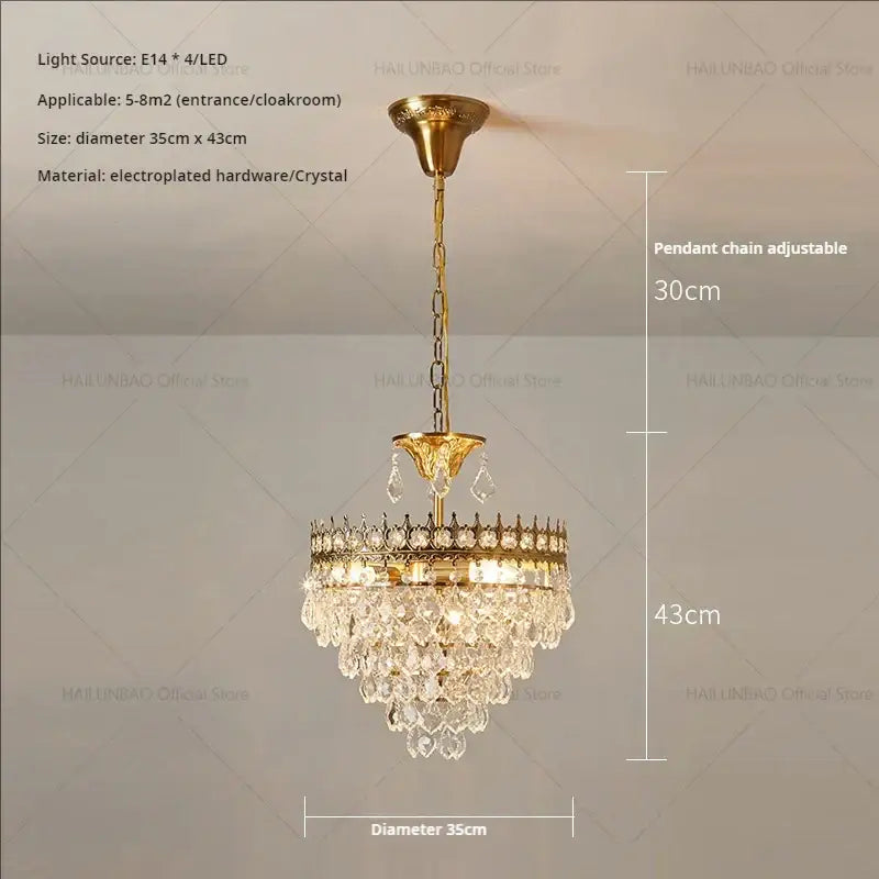 Gold-toned decorbites crystal chandelier with crystal droplets and decorative pendant chain for modern luxury lighting
