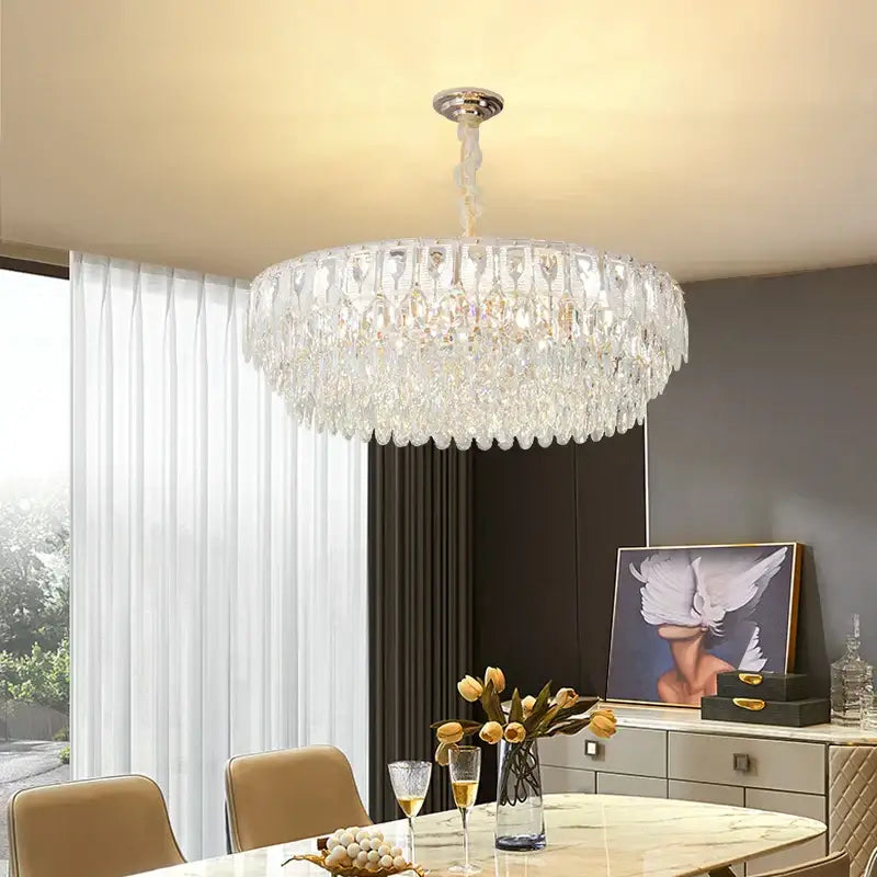 Decorbites crystal chandelier featuring a polished chrome mount and cascading faceted glass for modern luxury lighting