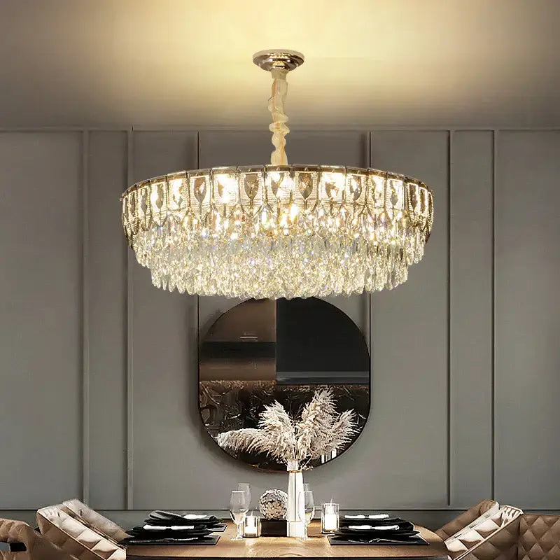 Decorbites crystal chandelier with cascading clear faceted crystals and gold-toned frame for modern luxury lighting