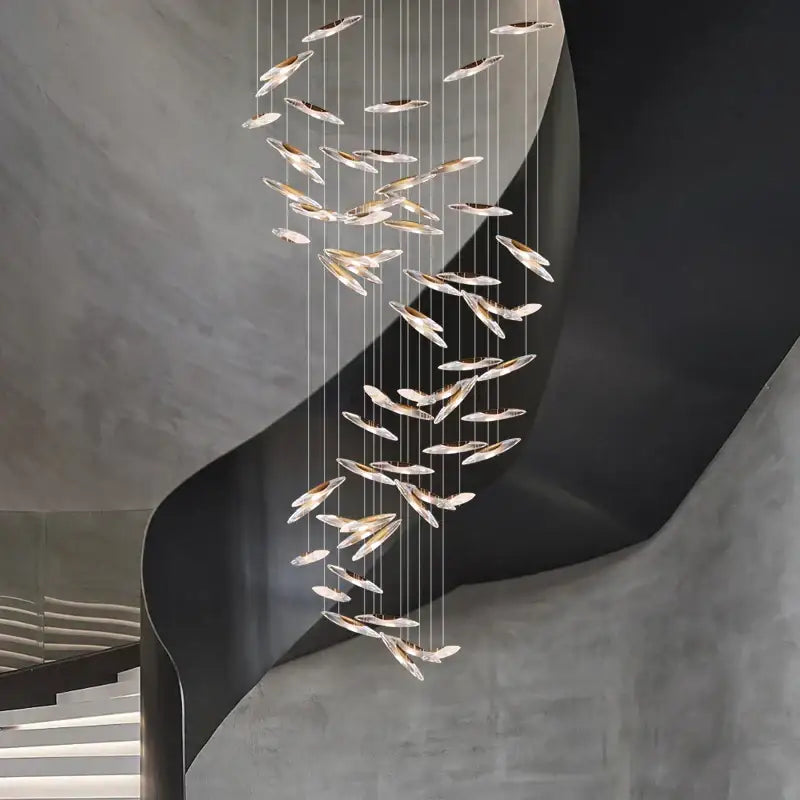 A modern decorbites crystal chandelier with translucent feather-shaped glass elements for luxury living spaces