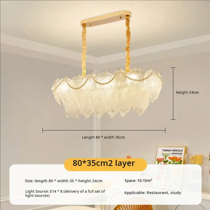 A decorbites crystal chandelier with two layers of translucent glass petals and gold-toned metal for modern luxury lighting