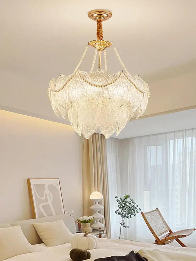 Elegant gold-toned decorbites crystal chandelier with layered translucent crystal petals and beaded chains for modern luxury lighting