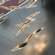 Modern minimalist decorbites crystal chandelier with transparent glass teardrop pendants and gold metallic centers