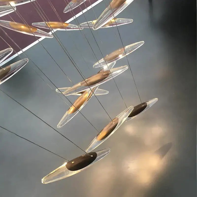 Modern minimalist decorbites crystal chandelier with transparent glass teardrop pendants and gold metallic centers