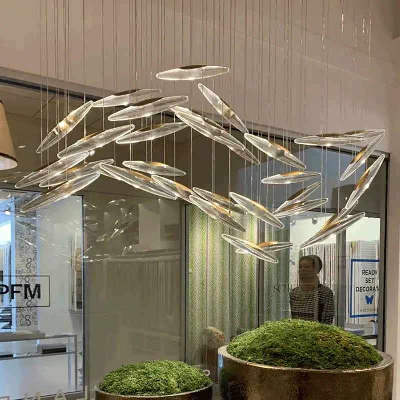 Decorbites crystal chandelier featuring modern transparent glass with elongated oval shapes for luxury living spaces