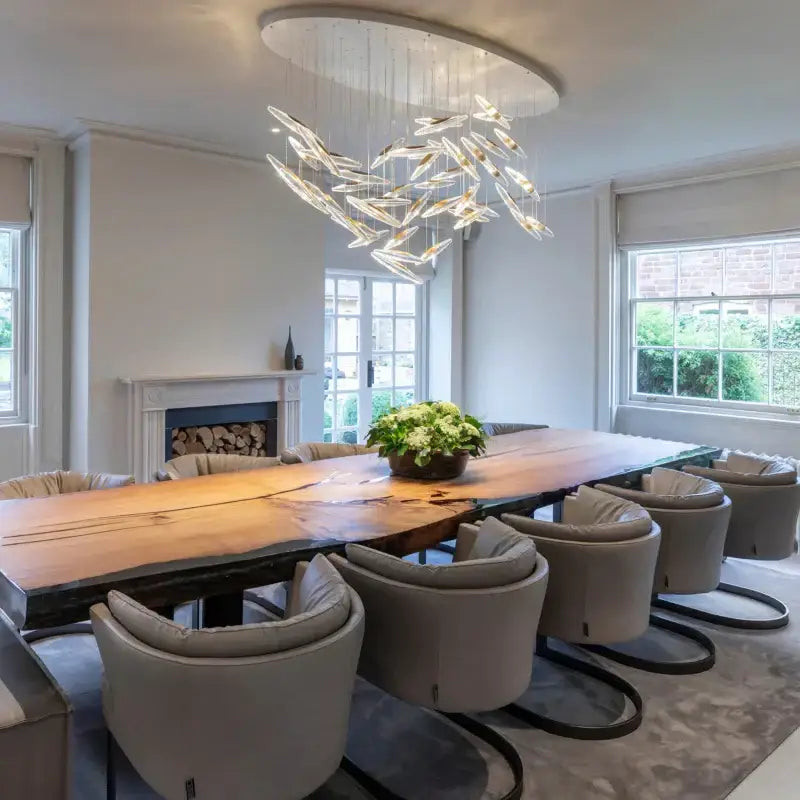 A modern circular decorbites crystal chandelier with translucent glass elements and sleek metallic frame for luxury lighting