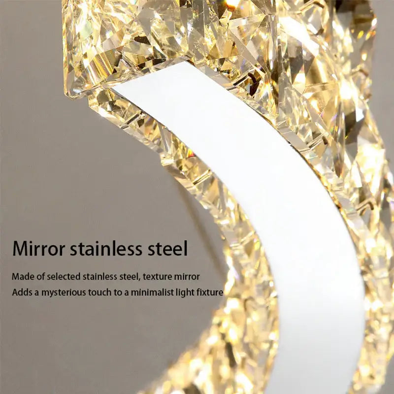 A sleek DecorBites crystal chandelier with mirror stainless steel frame and faceted crystals for living room lamps