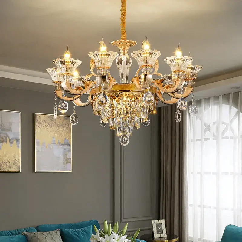 A luxurious gold-toned DecorBites crystal chandelier pendant with ornate arms and crystal droplets for villa duplex and hotel lobby