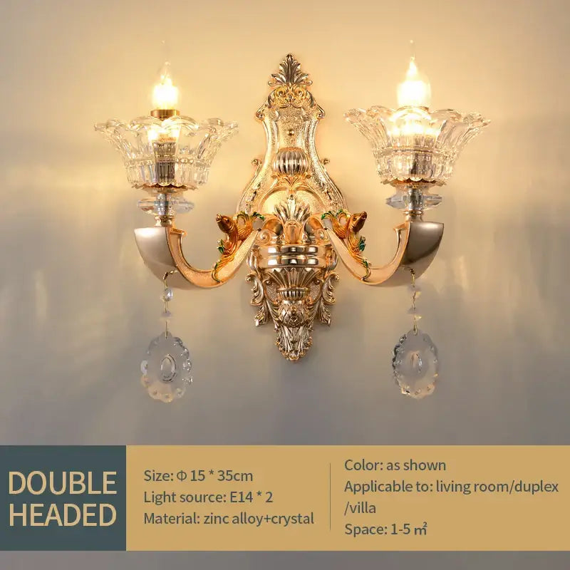 Gold-toned ornate double-headed wall sconce with crystal glass shades and dangling teardrop crystals decorbites crystal chandelier pendant