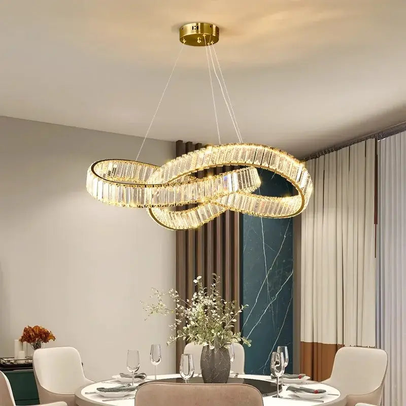Gold-toned decorbites crystal chandelier pendant lamp with faceted crystal accents for modern dining and living rooms