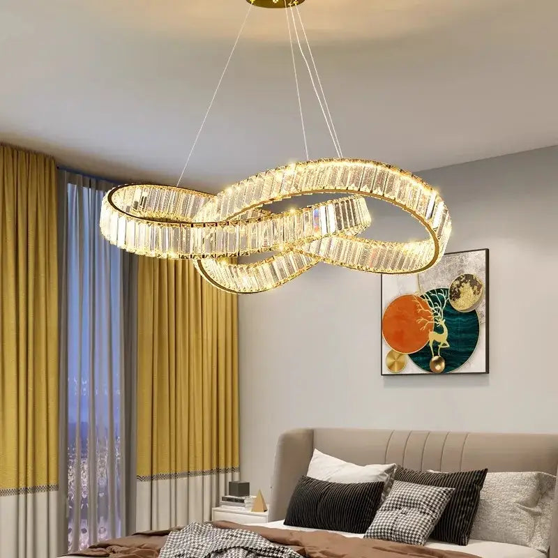 Golden infinity-loop decorbites crystal chandelier pendant with faceted crystal accents for modern living and dining rooms