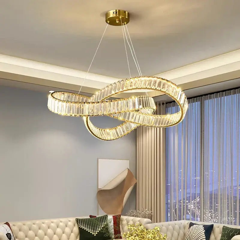 Gold-toned decorbites crystal chandelier pendant lamp with faceted crystal accents for modern living and dining rooms