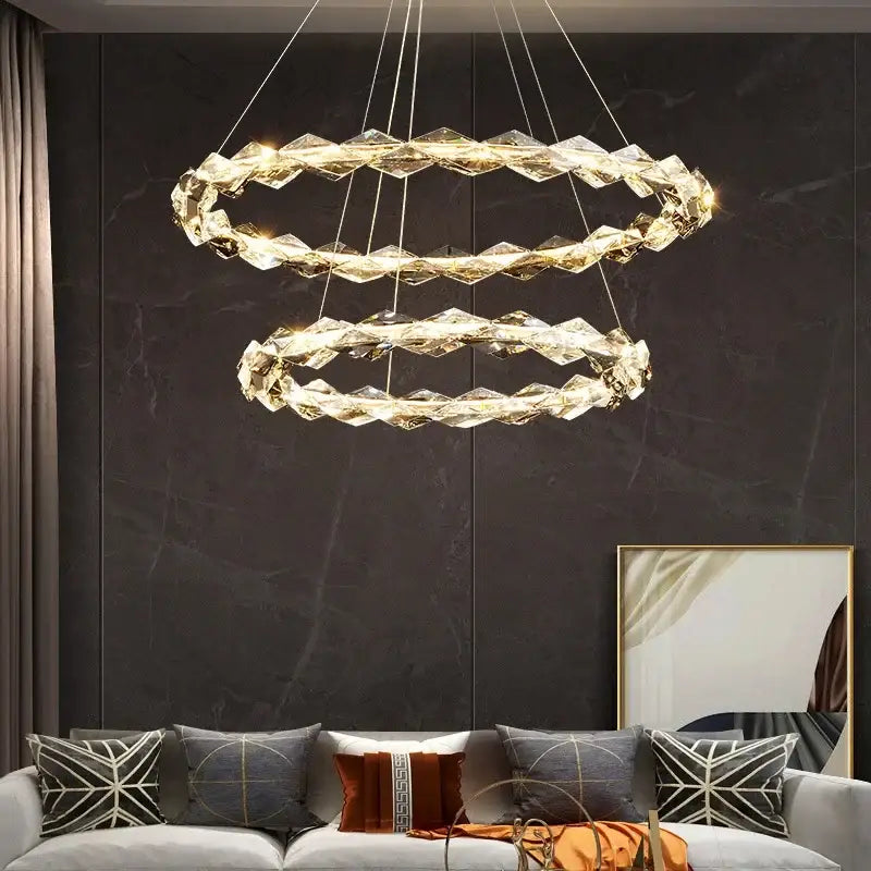 Decorbites crystal chandelier pendant light with faceted crystal rings and warm led lighting in chrome finish