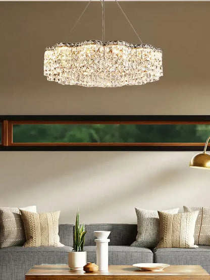 A sparkling circular decorbites crystal chandelier pendant light with faceted design hangs as an elegant lamp fixture