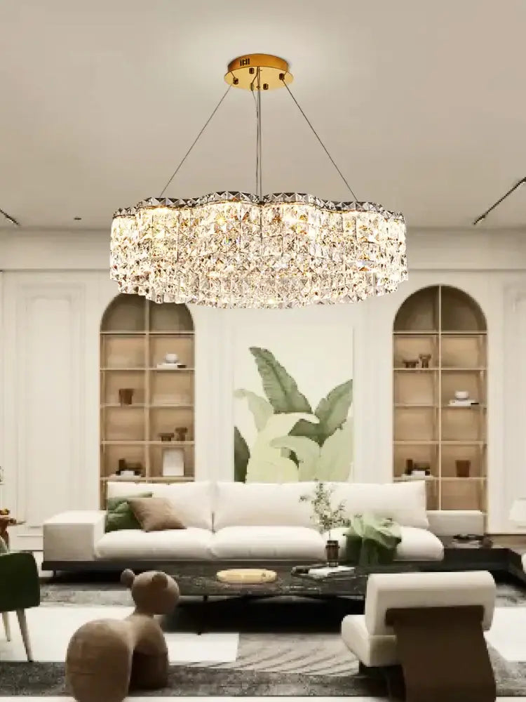 A luxurious gold-toned decorbites crystal chandelier pendant light with circular design and sparkling crystal facets