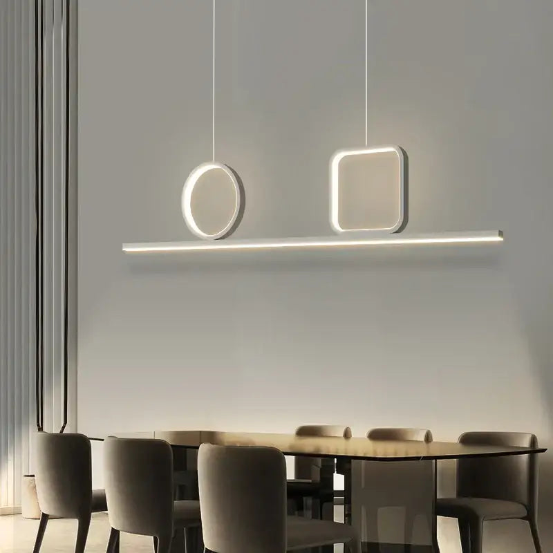 Modern minimalist decorbites crystal chandelier pendant light with white circular and square fixtures above dining table