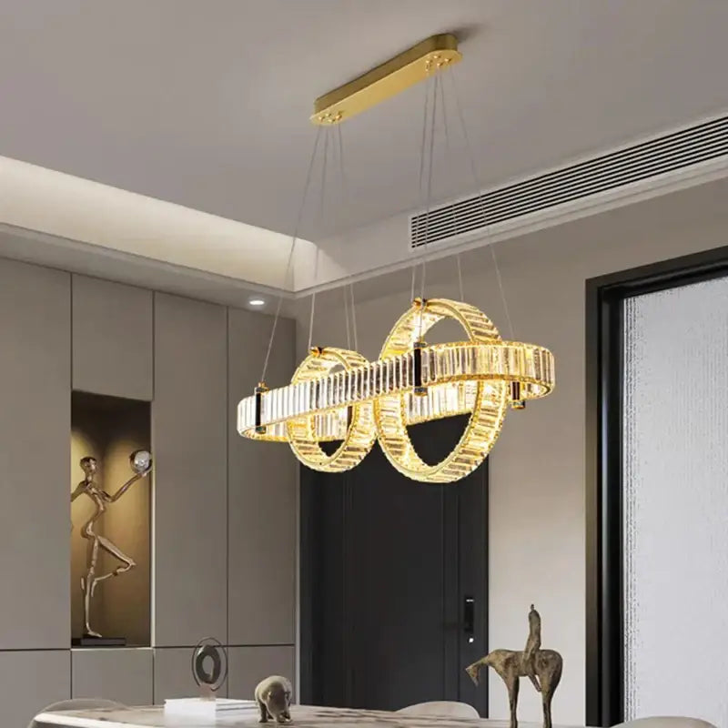 Golden decorbites crystal chandelier pendant light with interlocking ring design for living and dining room decor