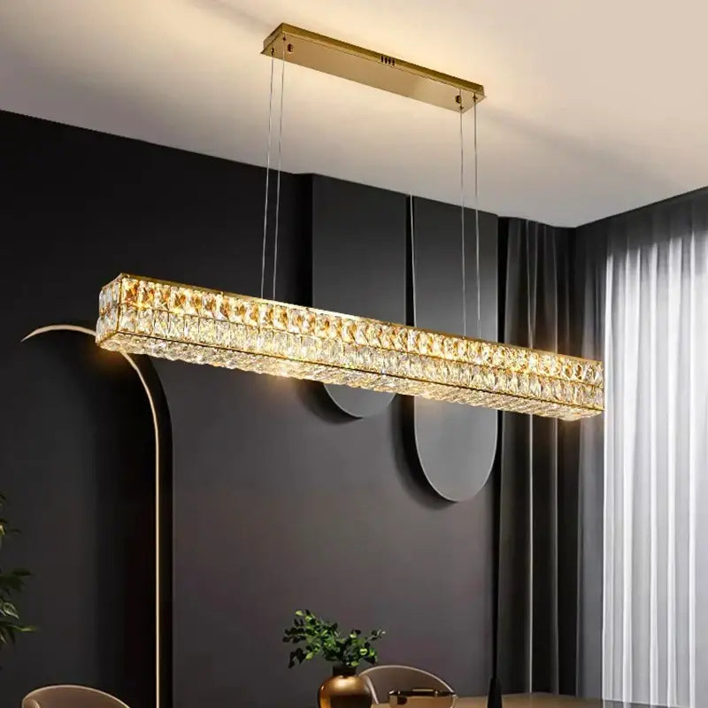 Gold-toned DecorBites crystal chandelier pendant light with embedded crystal facets for living and dining rooms