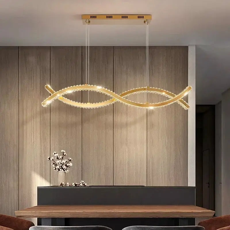 Gold-toned decorbites crystal chandelier pendant light with sleek double-loop design and sparkling crystal accents for living room