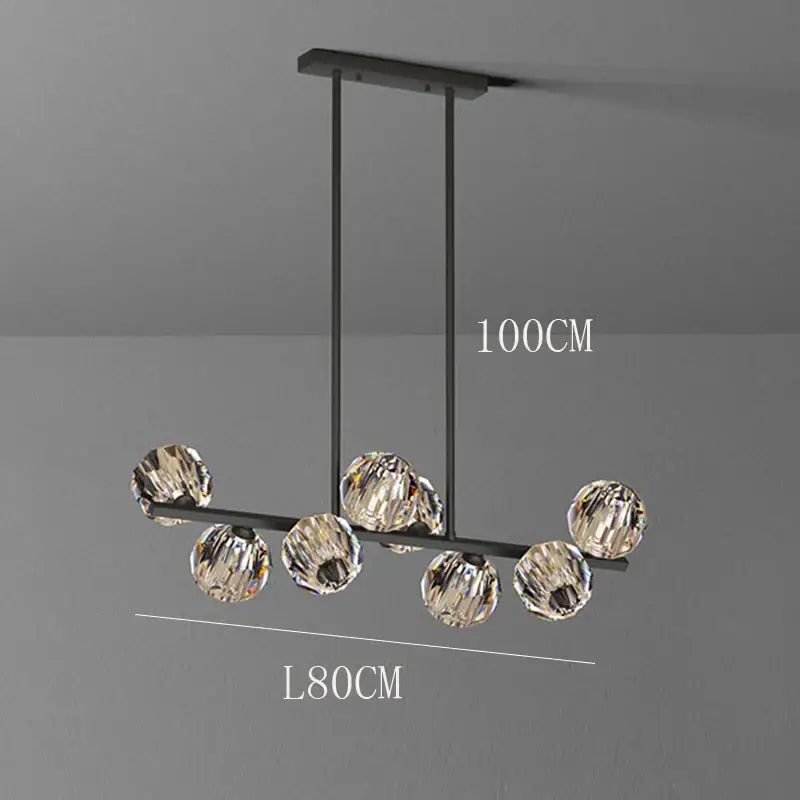 Modern black metal pendant light featuring seven faceted crystal spheres in the DecorBites crystal chandelier pendant