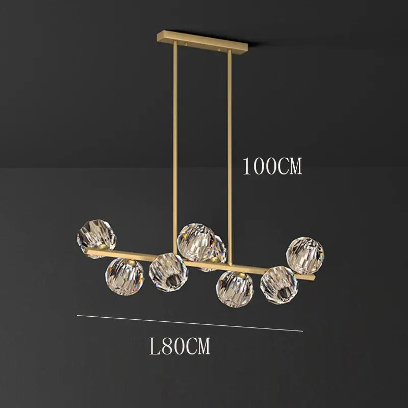 Gold-toned DecorBites crystal chandelier pendant light with seven faceted crystal spheres for living and dining rooms