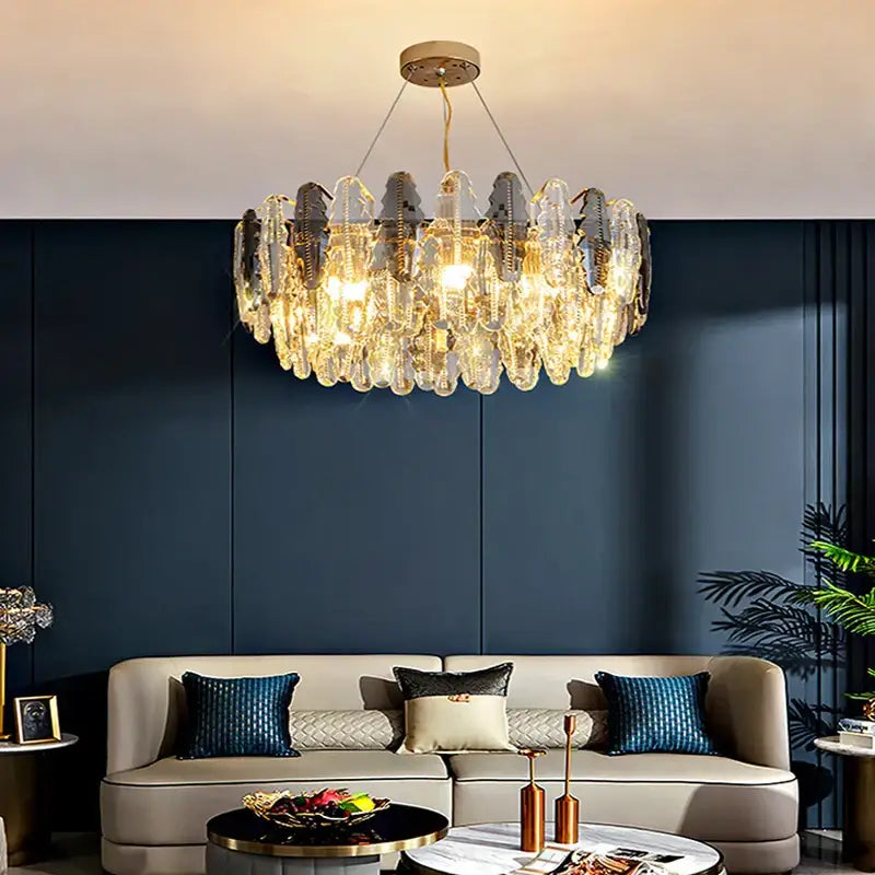 A decorbites crystal chandelier pendant light featuring cascading clear and frosted glass prisms with gold mount