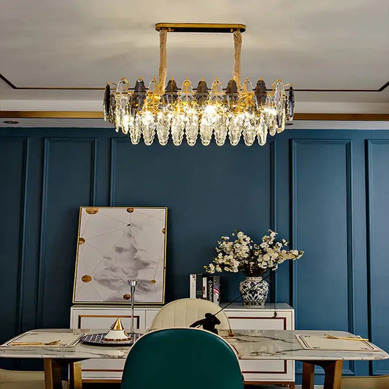 Gold-toned decorbites crystal chandelier pendant light with cascading clear crystal droplets and dark accents for living room