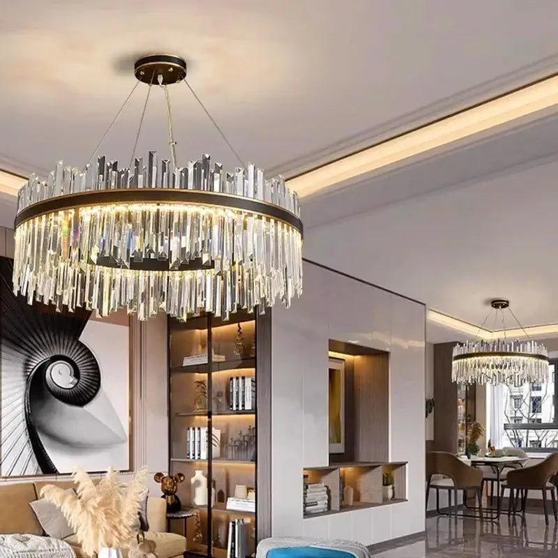 A modern decorbites crystal chandelier pendant light with a black metal frame and cascading clear crystal prisms for indoor use