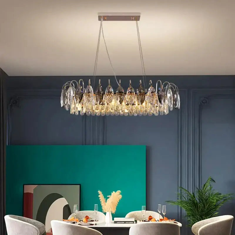 A decorbites crystal chandelier pendant light with clear and dark glass on a metallic frame for indoor use
