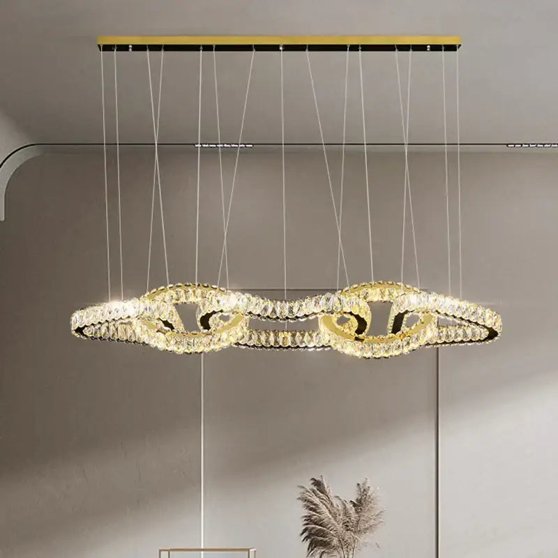 Gold-toned decorbites crystal chandelier pendant light with intertwined crystal rings for living room ceiling lighting