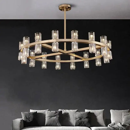 Gold-toned DecorBites crystal chandelier pendant with clear glass cylindrical shades for living and dining room lighting