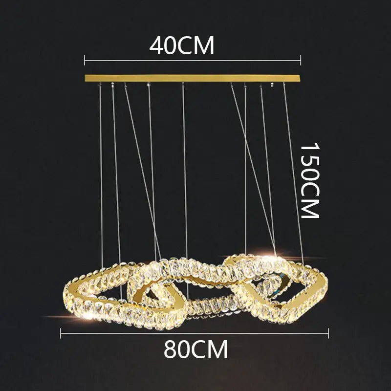 Gold-toned decorbites crystal chandelier pendant light with two interlocking rings adorned with clear crystals for living room