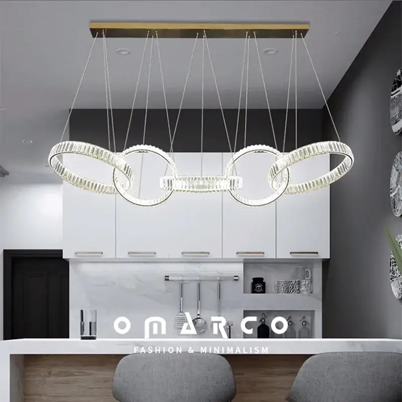 Modern decorbites crystal chandelier pendant light with interlocking circular rings and gold-toned ceiling mount