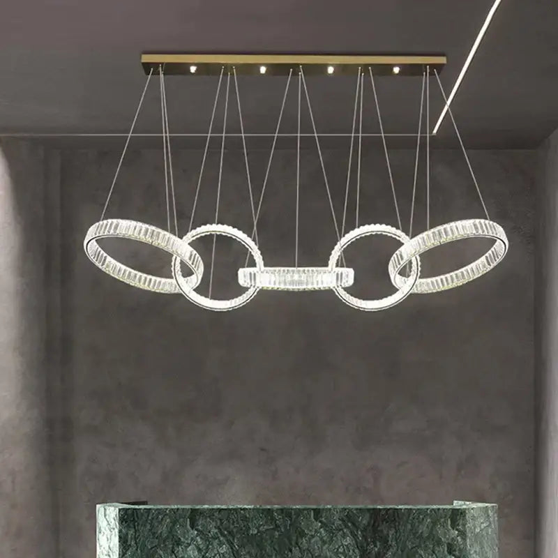 Modern decorbites crystal chandelier pendant light with interlocking rings and gold-toned ceiling mount for living room
