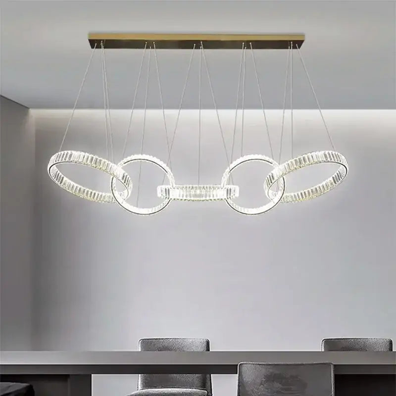 Modern decorbites crystal chandelier pendant light with clear faceted rings and gold rectangular ceiling mount for living room