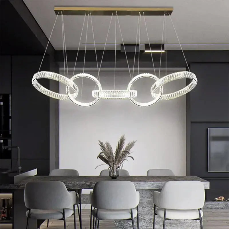 DecorBites crystal chandelier pendant light with gold-toned ceiling mount and interlocking rings for living room lighting