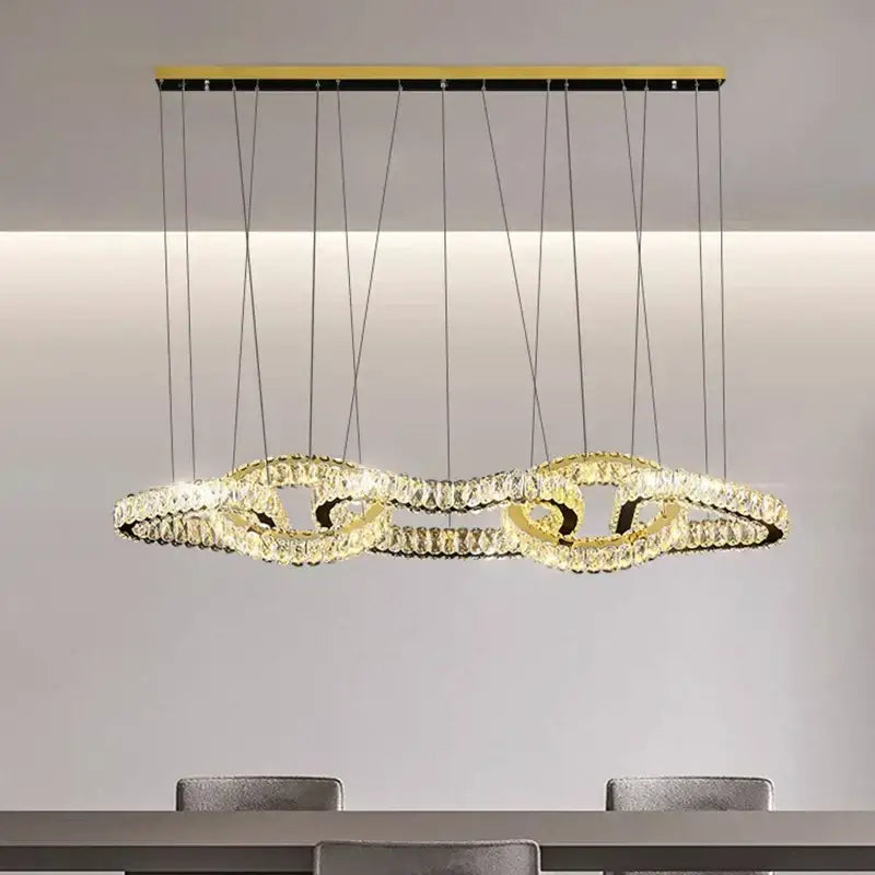 Gold-toned DecorBites crystal chandelier pendant light with interlocking crystal rings for living room ceiling decor