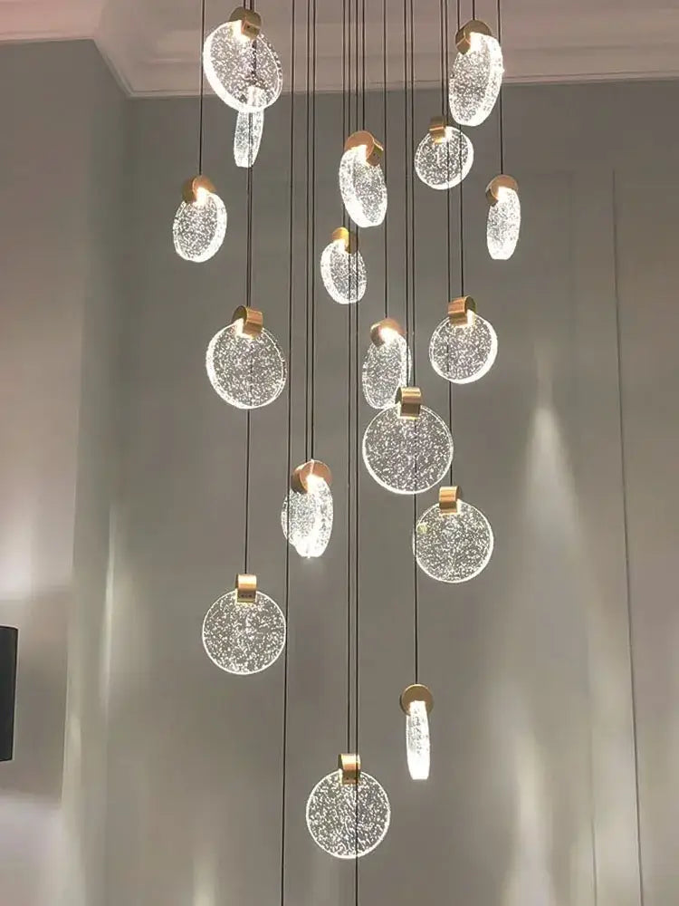 A decorbites crystal chandelier pendant light with gold-toned metal and crackled glass orbs for luxury staircase